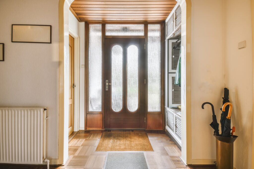 A hallway featuring a door and a wooden floor, branded with Clearview Windows & Doors.